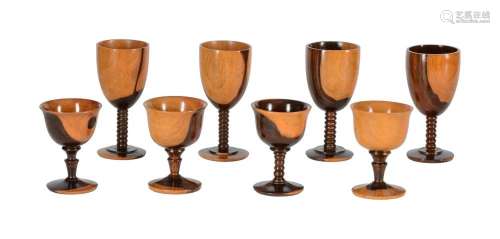 A GROUP OF EIGHT LIGNUM VITAE GOBLETS