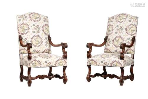 A PAIR OF CARVED WALNUT AND UPHOLSTERED OPEN ARMCHAIRS IN LO...