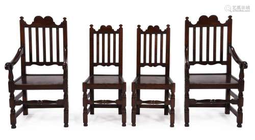 A SET OF EIGHT STAINED OAK DINING CHAIRS IN EARLY 18TH CENTU...