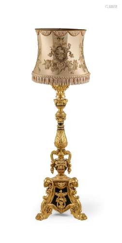 A GILTWOOD AND EBONISED TORCHERE IN 18TH CENTURY ITALIAN STY...
