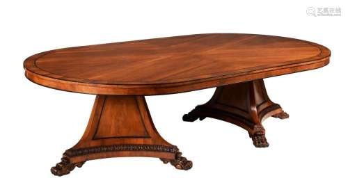 A MAHOGANY TWIN PEDESTAL OVAL DINING TABLE IN GEORGE IV STYL...