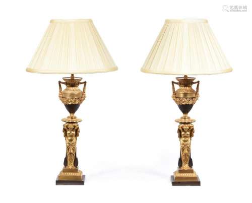 A PAIR OF BRONZE AND GILT LAMPS IN NEOCLASSICAL TASTE