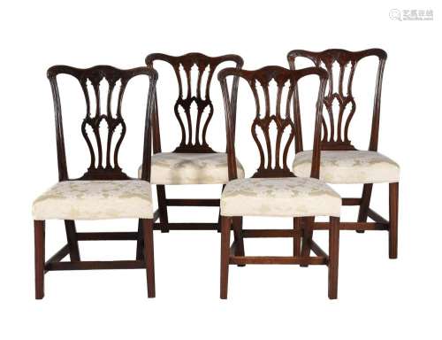 A SET OF FOUR GEORGE III CARVED MAHOGANY SIDE CHAIRS