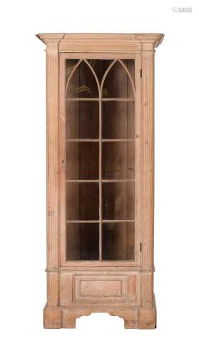 A DISTRESSED LIMED PINE DISPLAY CABINET