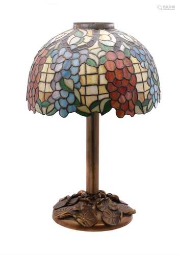 A LARGE GILT METAL AND LEADED GLASS TABLE LAMP