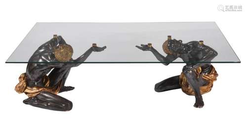 A PATINATED COMPOSITION LOW CENTRE TABLE