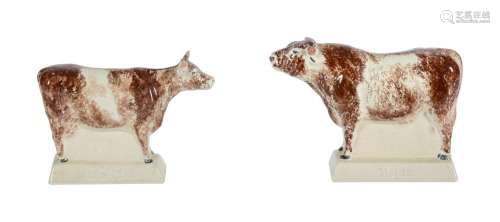 A PAIR OF MODERN RYE POTTERY TITLED MODELS OF A COW AND BULL