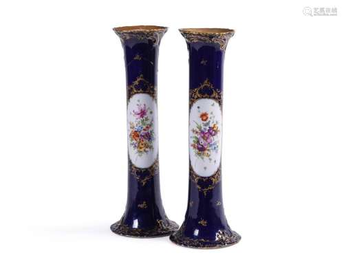 A PAIR OF DRESDEN PORCELAIN BLUE GROUND AND GILT CYLINDRICAL...