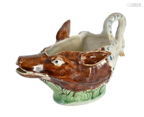 A STAFFORDSHIRE PEARLWARE FOX-MASK SWAN-HANDLED SAUCE BOAT O...