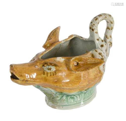 A STAFFORDSHIRE PEARLWARE FOX-MASK SWAN-HANDLED SAUCE BOAT O...