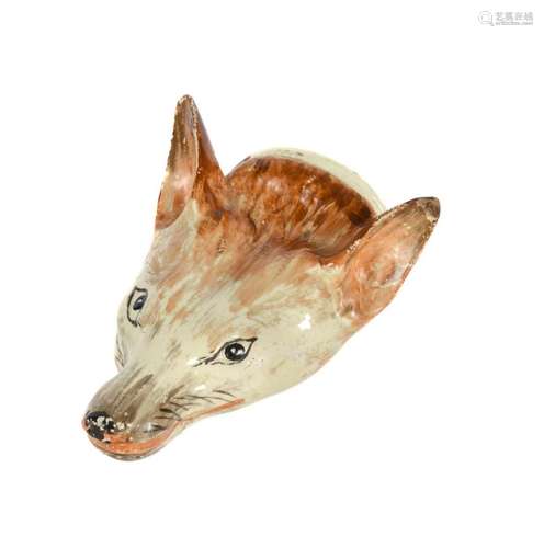 A STAFFORDSHIRE CREAMWARE FOX MASK STIRRUP CUP