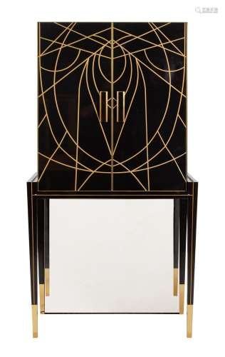 A BLACK AND GOLD COCKTAIL CABINET IN ART DECO STYLE