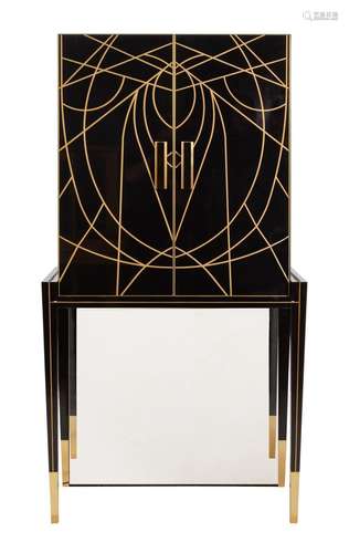 A BLACK AND GOLD COCKTAIL CABINET IN ART DECO STYLE