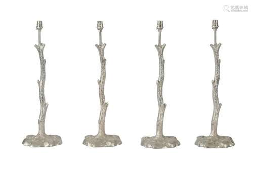 A SET OF FOUR SILVERED METAL TABLE LAMPSOF RECENT MANUFACTUR...