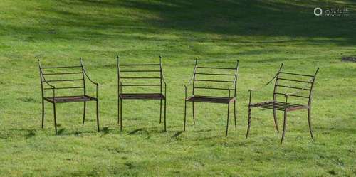 A SET OF FOUR IRON GARDEN CHAIRS