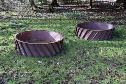 A PAIR OF SUBSTANTIAL CAST IRON AND SHEET METAL LINED CIRCUL...