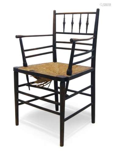 MORRIS & CO, AN EBONISED BEECH 'SUSSEX' ARMCHAIR...