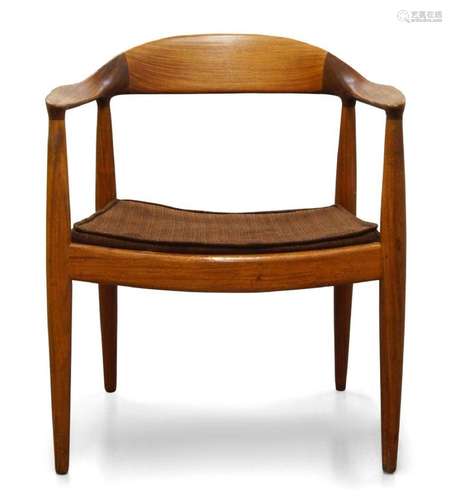 A TEAK ARMCHAIR AFTER A DESIGN BY HANS WEGNER, C.1960, WITH ...