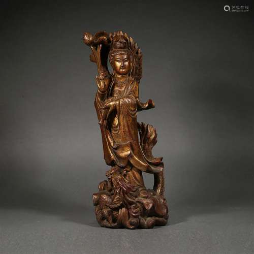 A Carved Wooden Figure of Guanyin