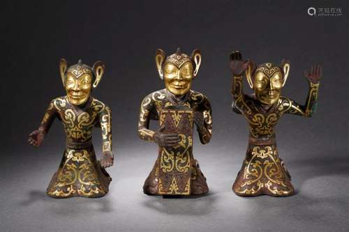 A Group of Bronze Partly Gilt Figures