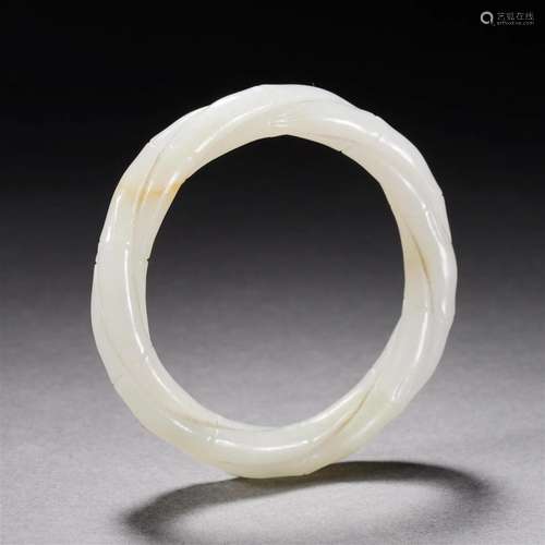 A Chinese Carved White Jade Bangle