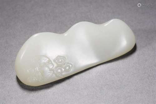 A Chinese Carved White Jade Brushrest