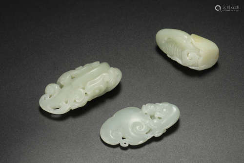 Three Carved Jade Dragon Pendants