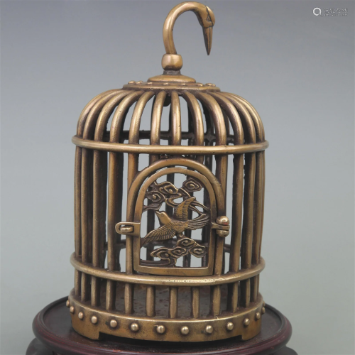 A SMALL BRONZE BIRD CAGE DISPLAY
