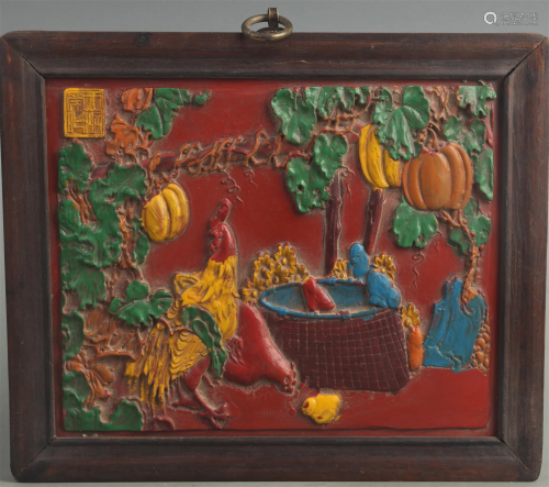 A FINE COLORED RED CARVED LACQUER WALL PLATE