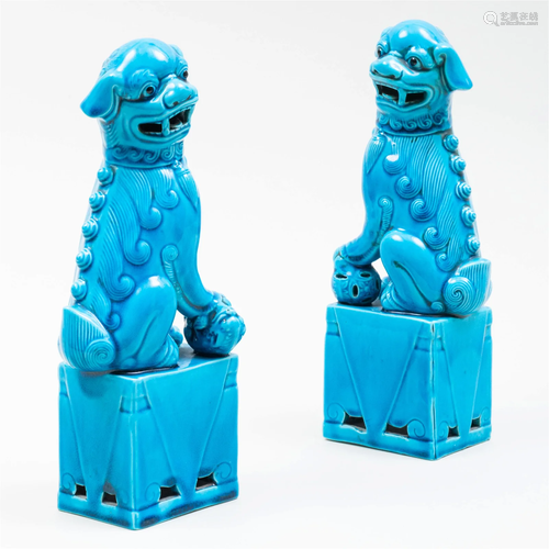 Pair of Chinese Turquoise Glazed Porcelain Figures of Buddhi...