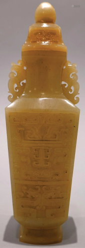 A jade carved bottle with cover.