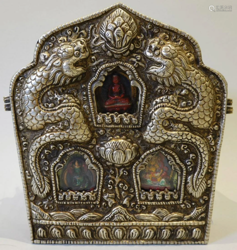 A Tibetan silver and bronze altar with double dragon design....