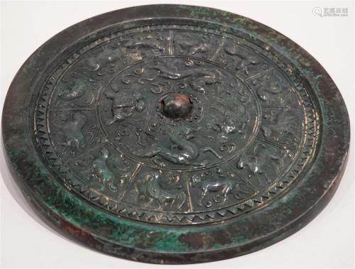A bronze mirror with 12 chinese zodiac signs and dragon and ...