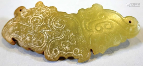 A jade Huang with carving of immortal being.
