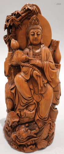 A boxwood carved figure of GuanYin