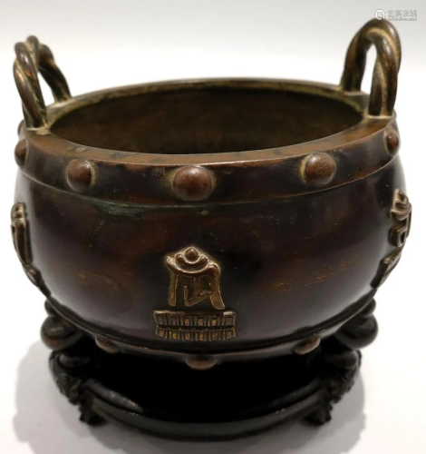 A bronze tripot censer, with original sandalwood (Zitan) sta...