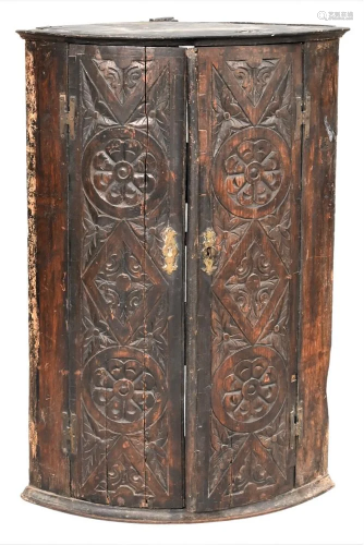 English Oak Corner Hanging Cabinet, having two carved doors,...