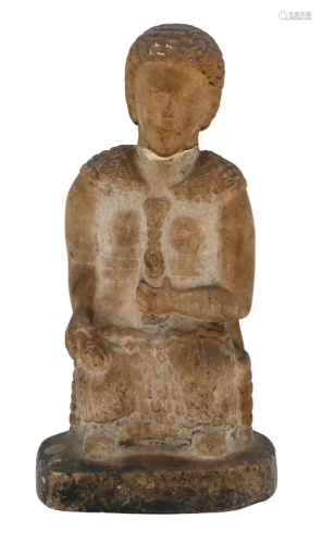 Early Carved Marble Figure, partially clad sitting in a chai...