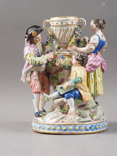 A 19th century Continental table centre group, figures garla...
