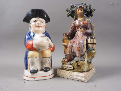 A 19th century style Staffordshire pottery figure Widow, 10 ...