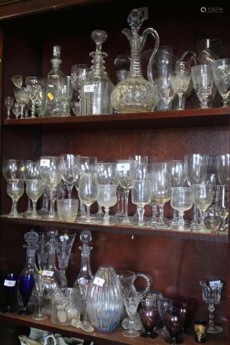 A triple ring necked decanter, six other decanters, a jug, t...