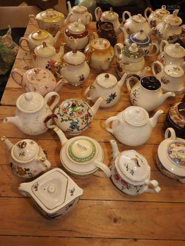 A collection of twenty-eight contemporary china teapots, inc...