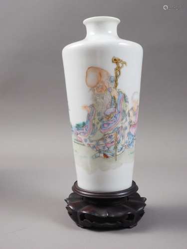 A Chinese porcelain tapered vase, decorated immortal and chi...