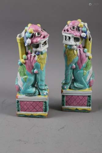 A pair of Chinese polychrome decorated Dogs of Fo, on square...