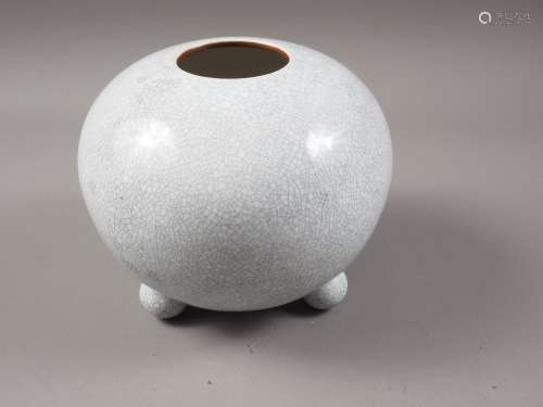A Chinese bulbous crackle glazed vase, on three bun feet, 6 ...