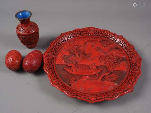 A Chinese carved cinnabar lacquer dish, decorated figures in...