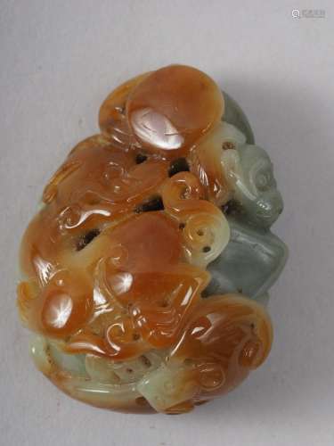 A Chinese carved jade boulder with monkey and mythical beast...