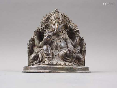 An Indian patinated brass figure of a Ganesh, 5 3/4 high