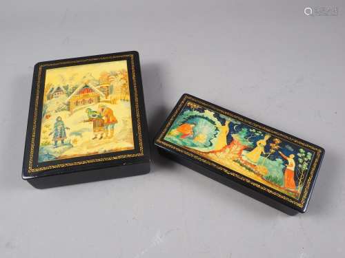 A Russian Palekh papier-mache box, the lid decorated winter ...
