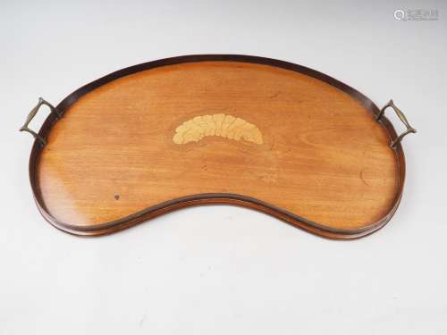 An Edwardian walnut shaped two-handled tray, 26 wide